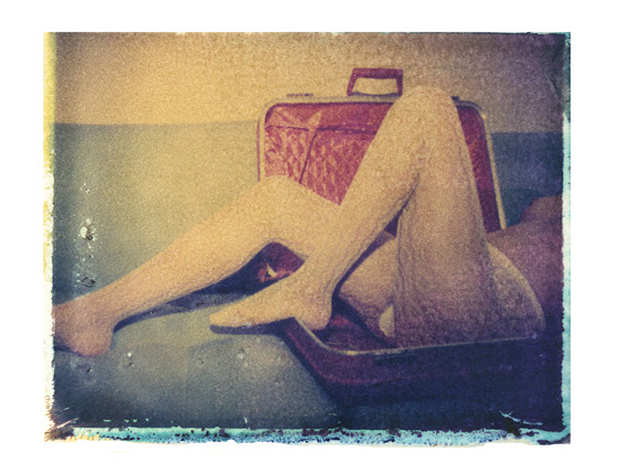 girl in suitcase